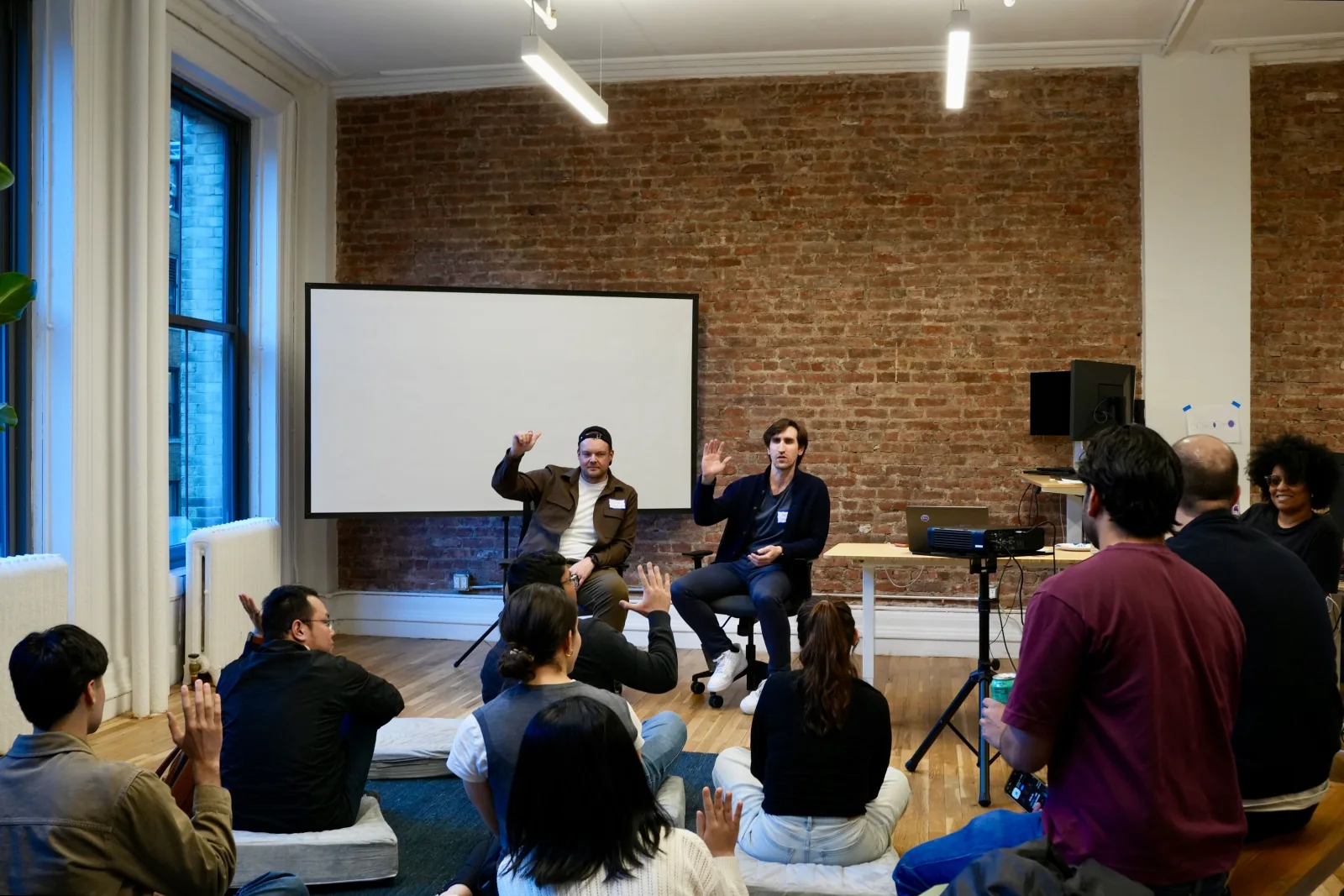 LM Studio team members attending a presentation in the office
